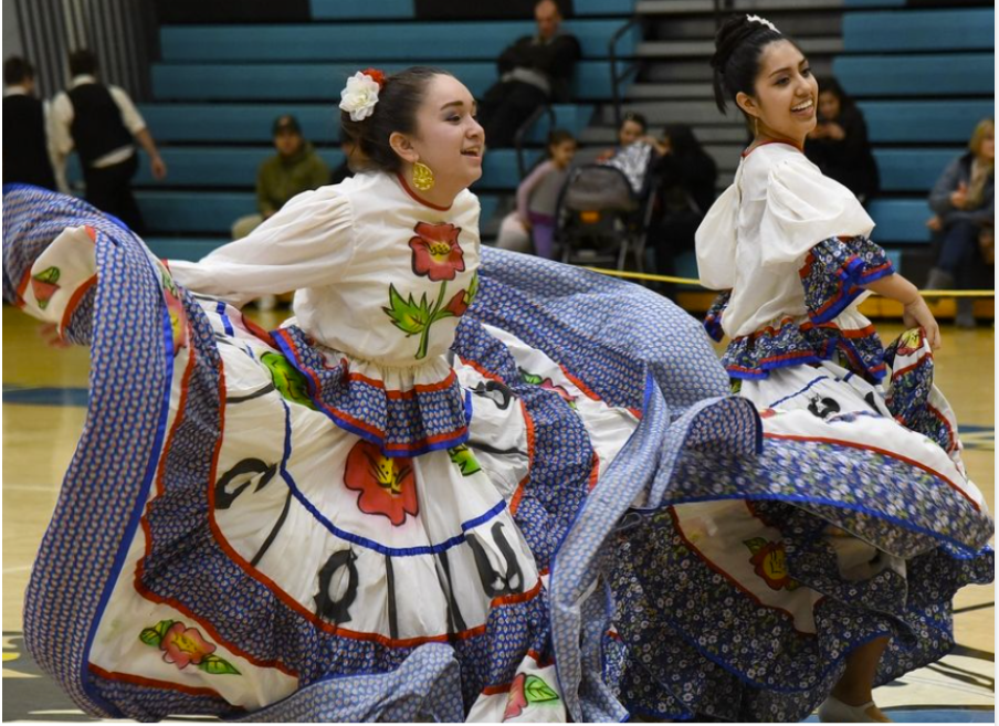 Valeria (right) and her teammate perform at her school's International Celebration