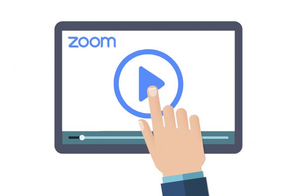 Hand pointing to a Zoom logo on a screen