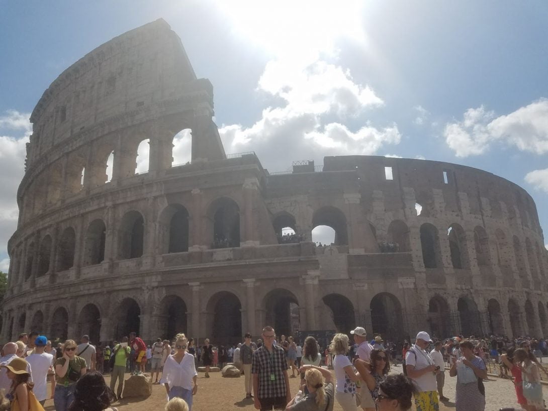 tourists in front of the Colosseum