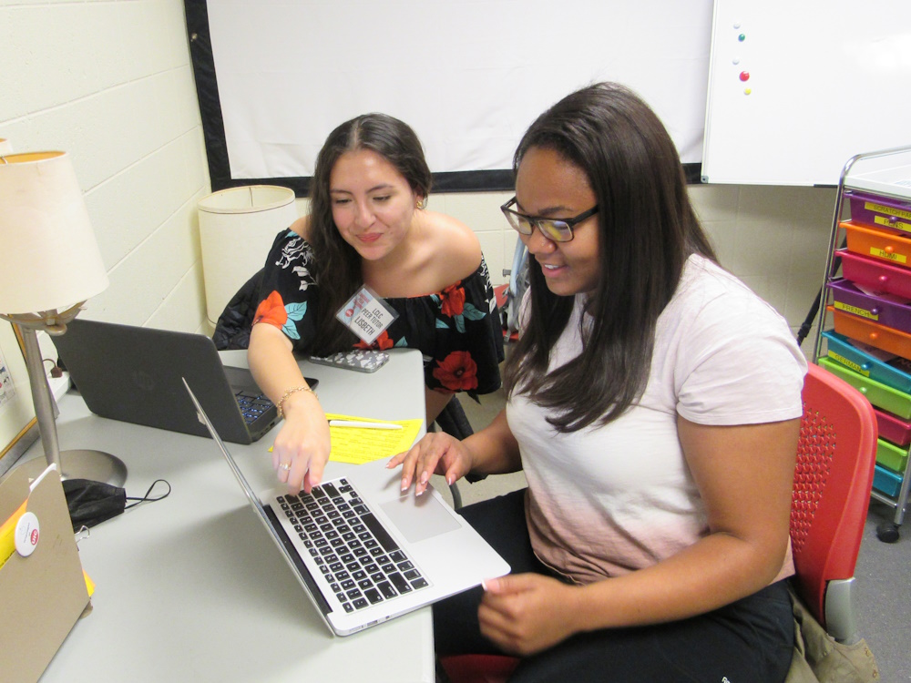 Spanish tutor Lisbeth works with a student in Grant Hall